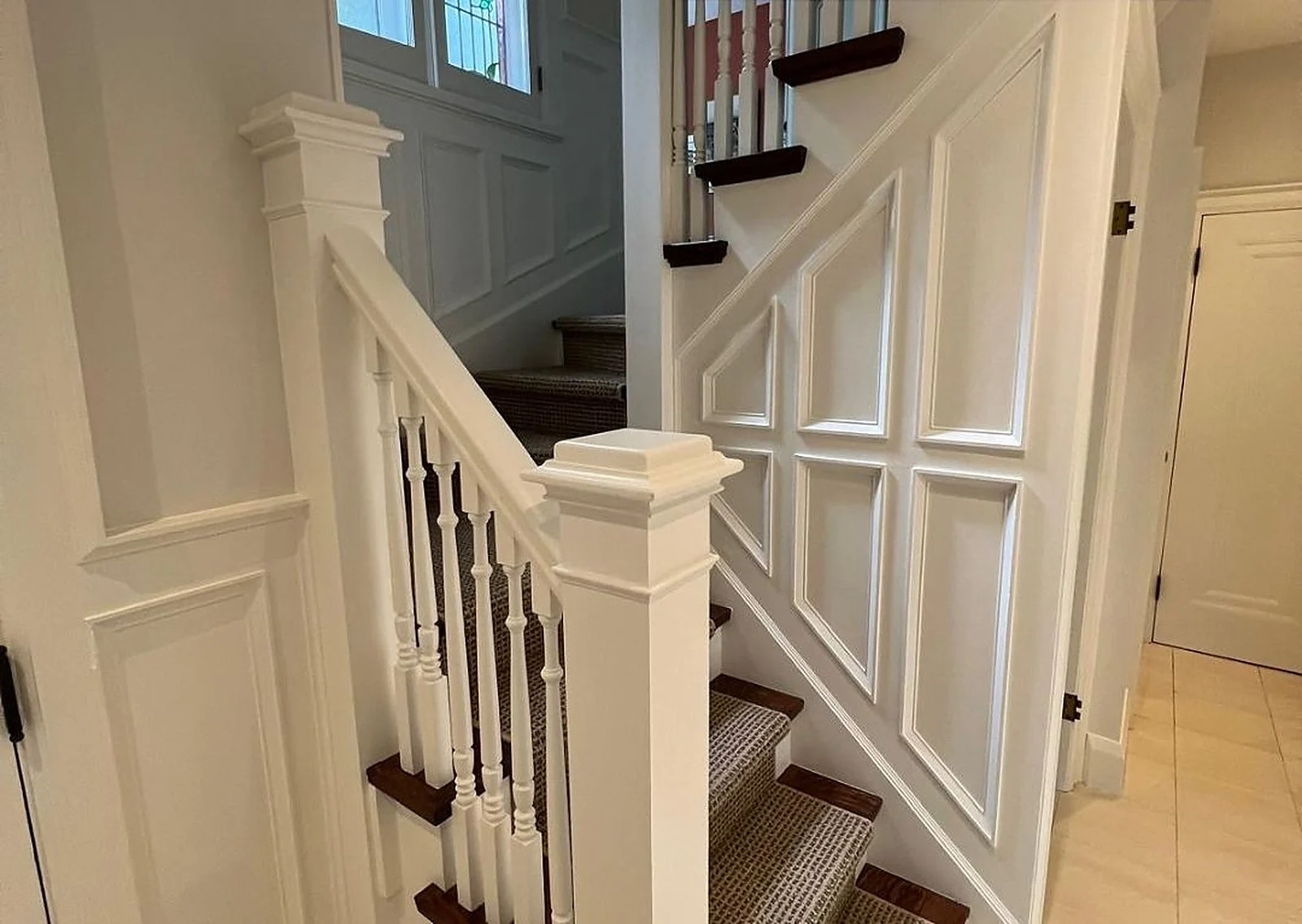 Staircase painted white with dark treads