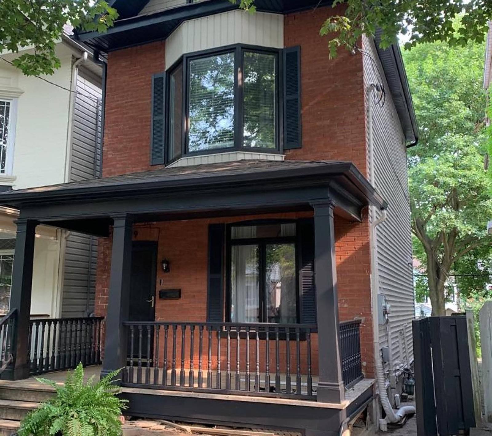 Riverdale semi with its porch and trim painted black