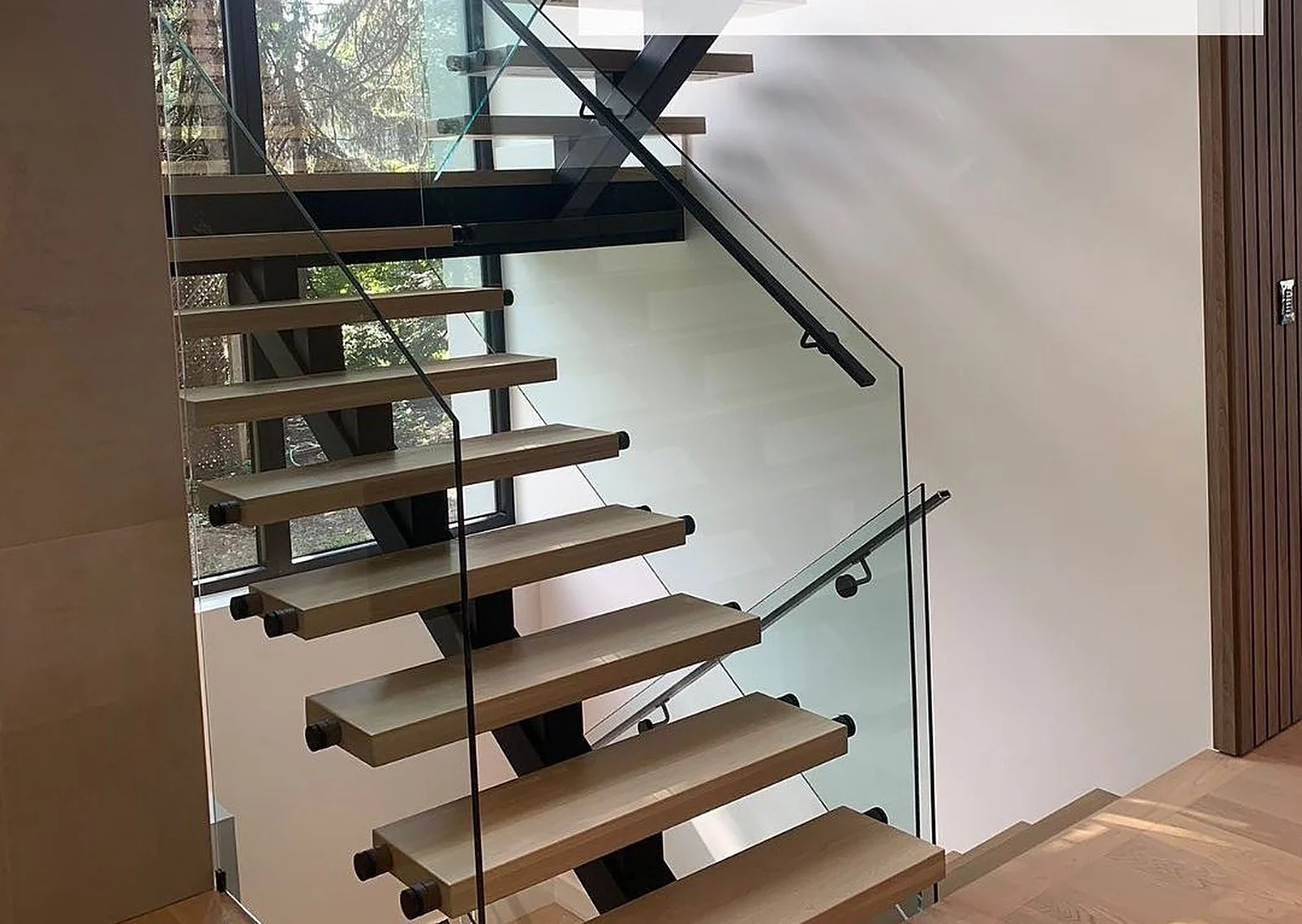 Floating staircase with glass railing