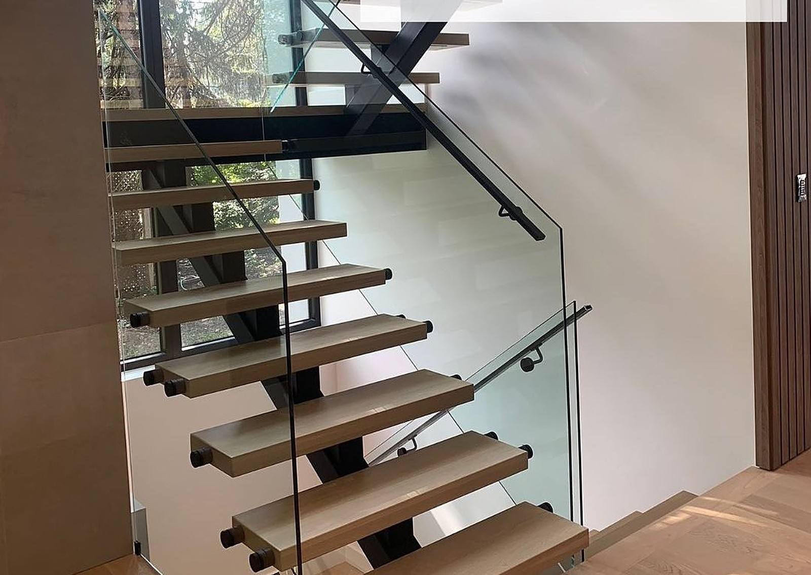 Floating staircase finished for Rymes Fine Homes in Mississauga