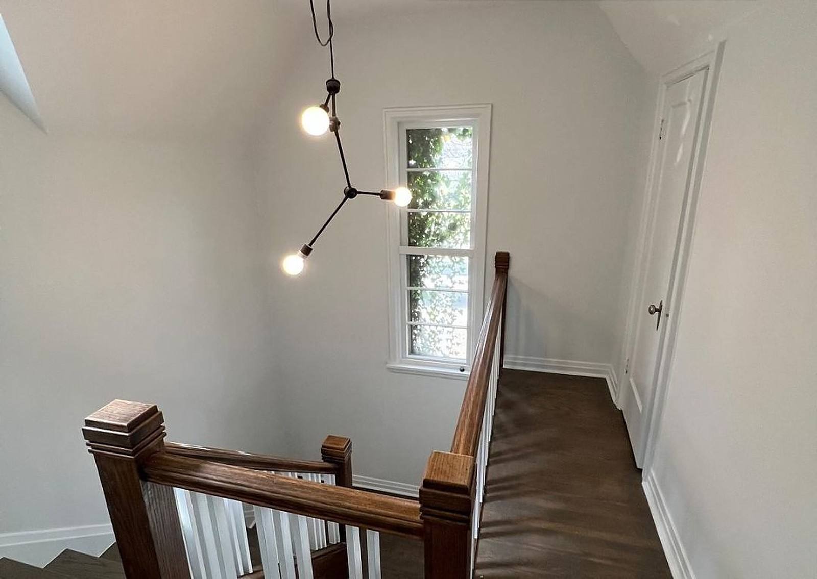 Stairwell after wallpaper removal and painting