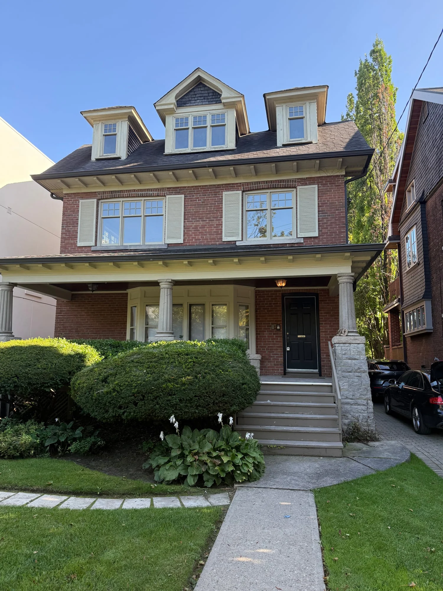 Before: the house with cream shutters and trim