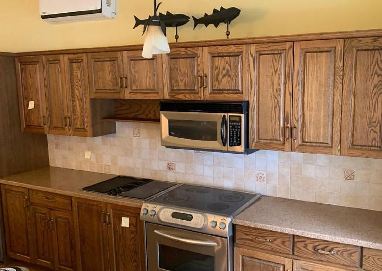 Before: Navy lowers, white uppers, and the armoire too, kitchen