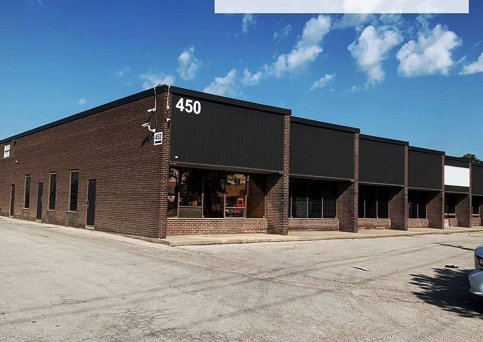 Before: A Vaughan building, brown to white and black, exterior