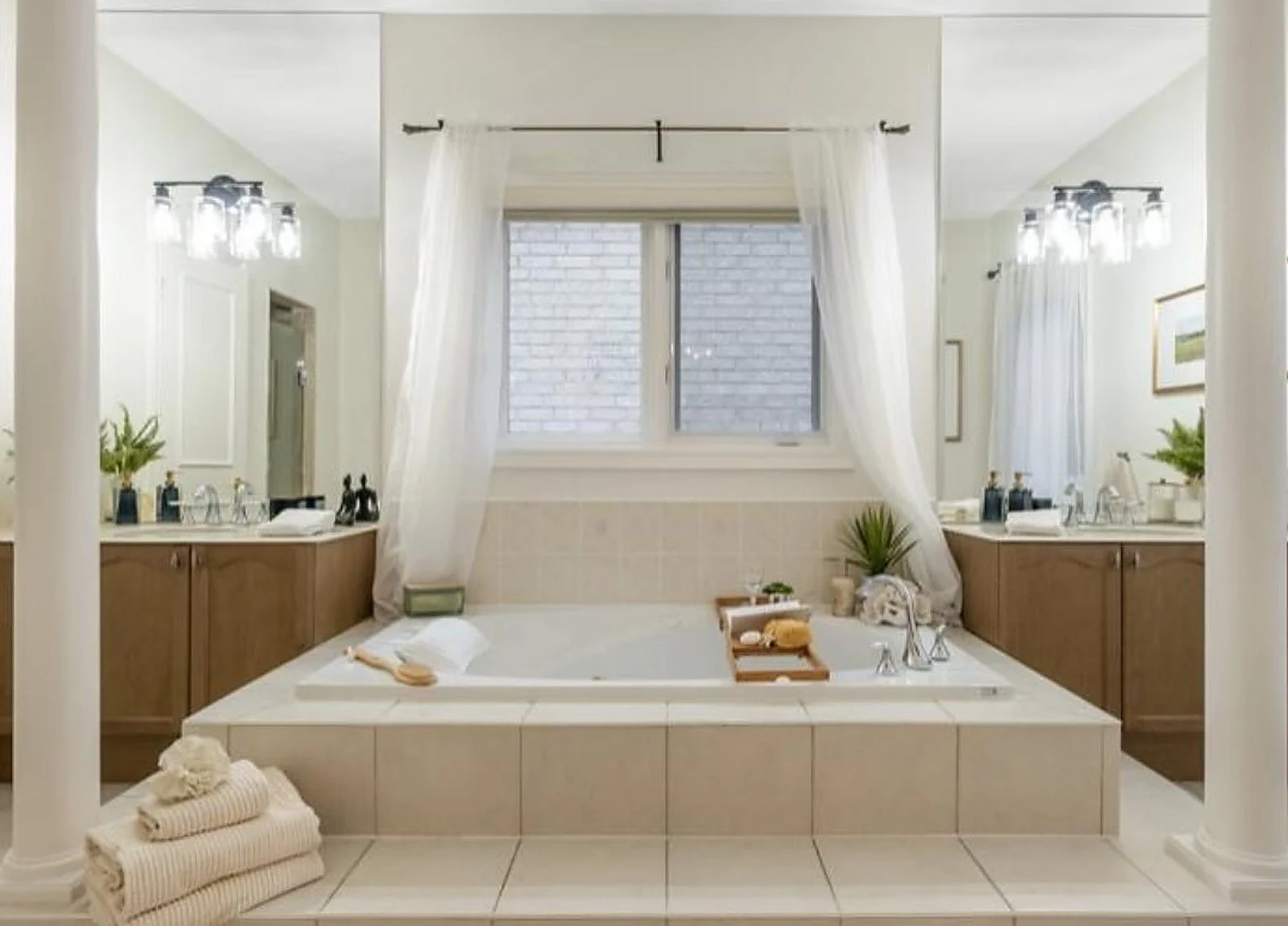 AFTER: ensuite with soaker tub, white walls