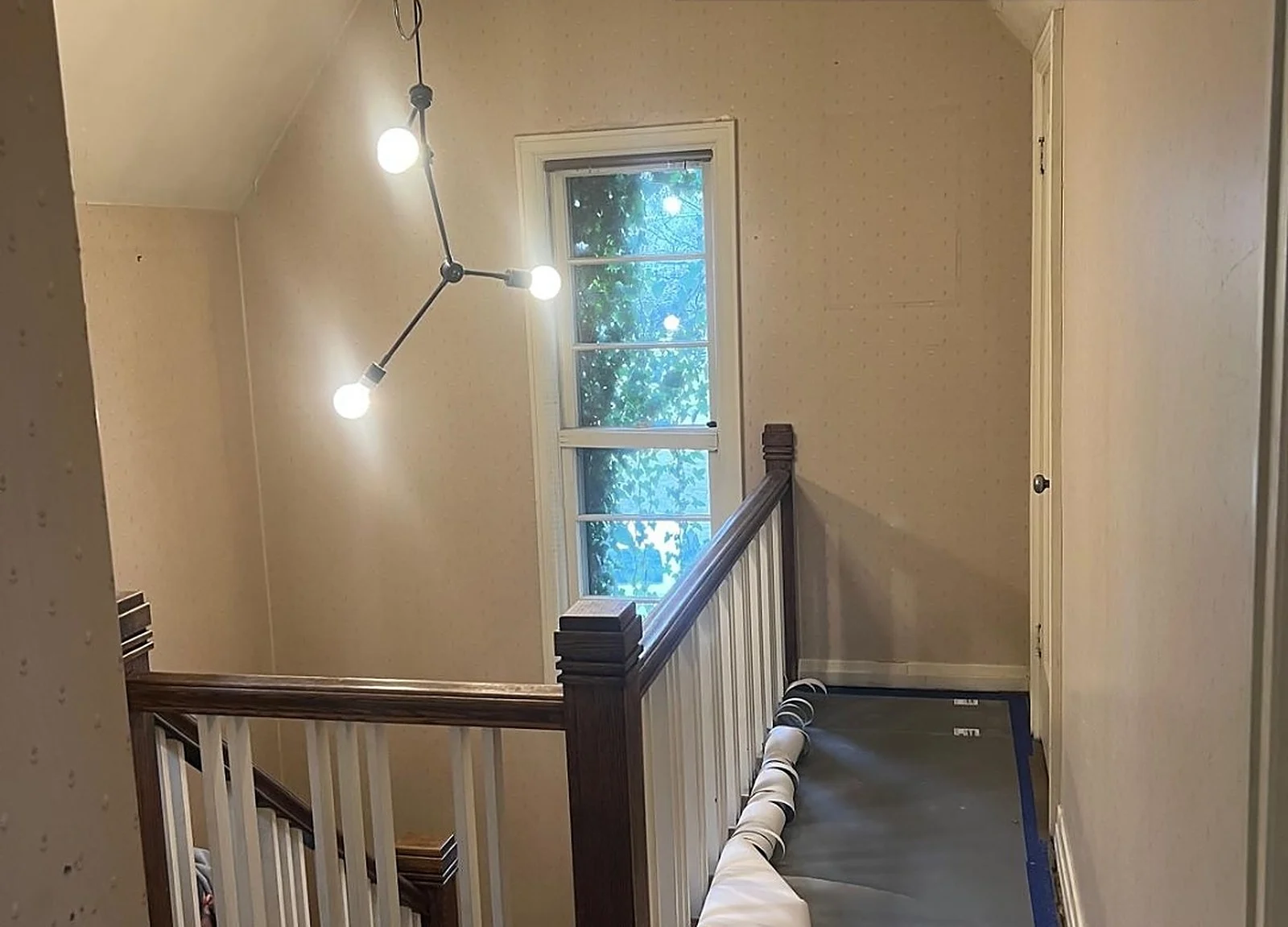 BEFORE: Hamilton upstairs hall with old wallpaper (Rymes)