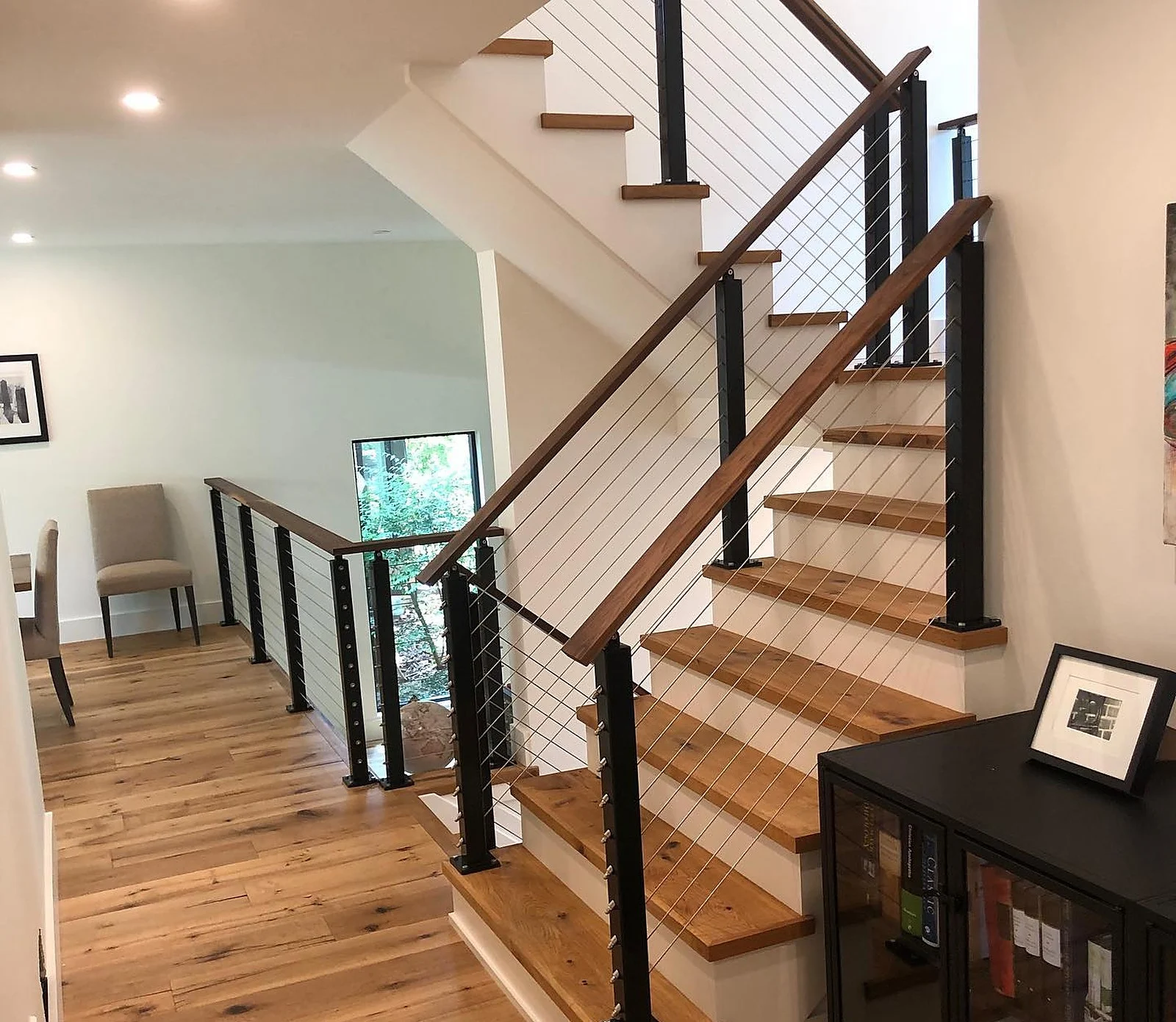 Oakville lakefront custom home staircase, cable railing, wood treads, white walls