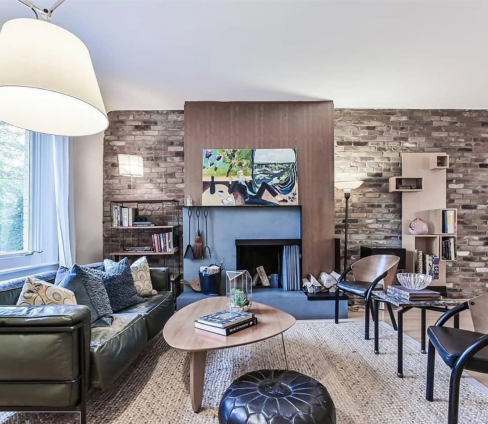Summerhill living room, brick fireplace wall, white walls (listing photo)