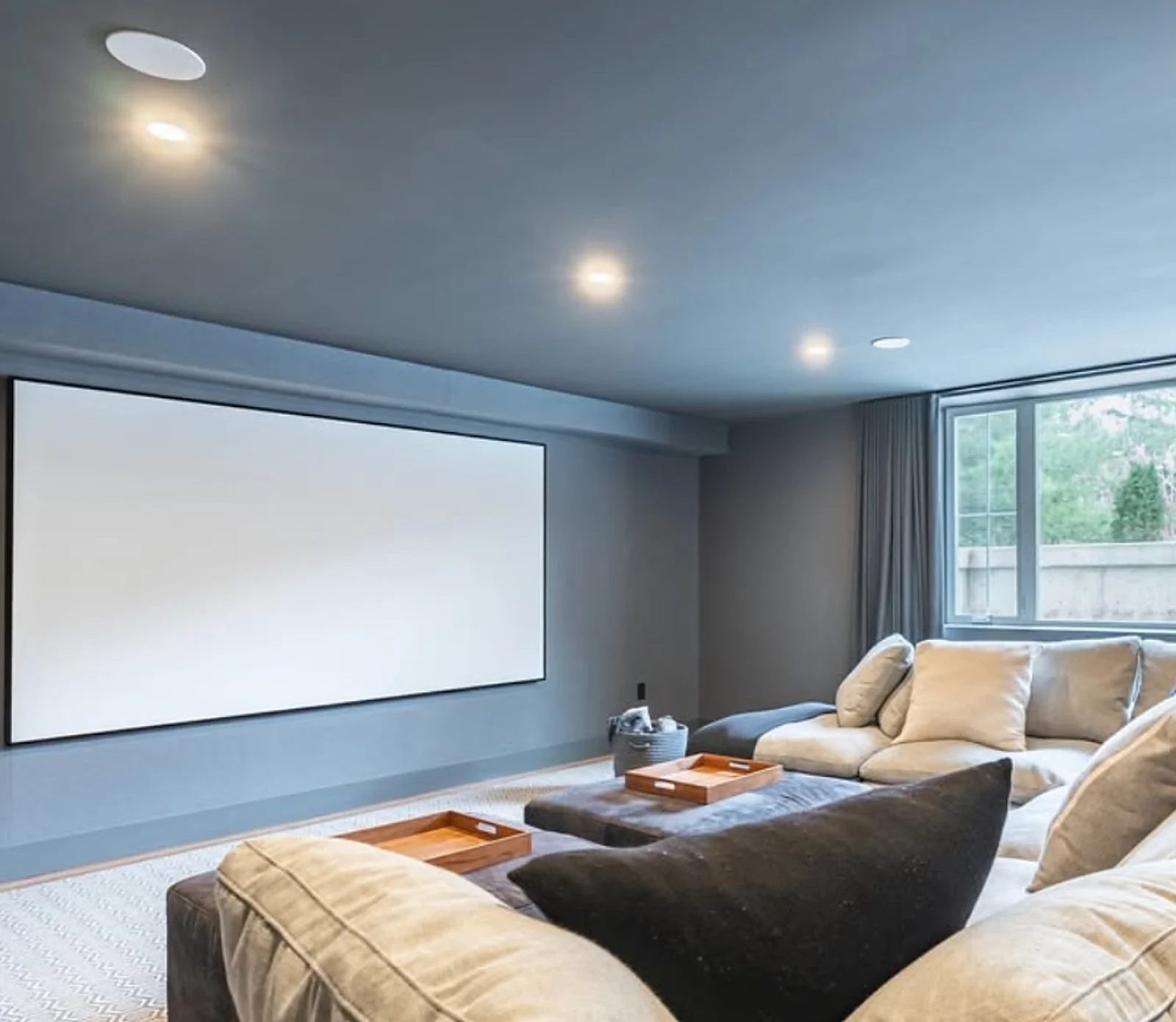 Basement media room, slate blue-grey walls, projector screen (One Life Design collab)