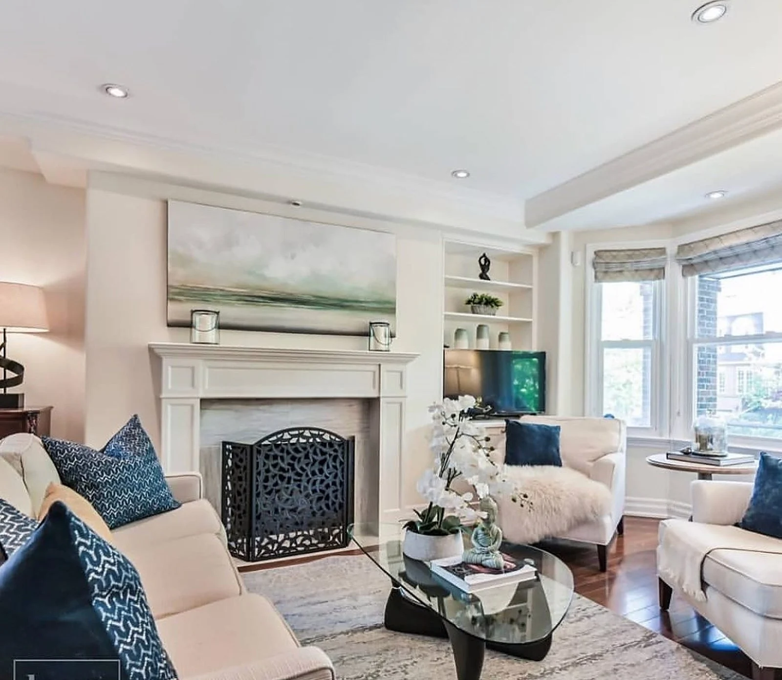 Midtown living room with white fireplace after painting