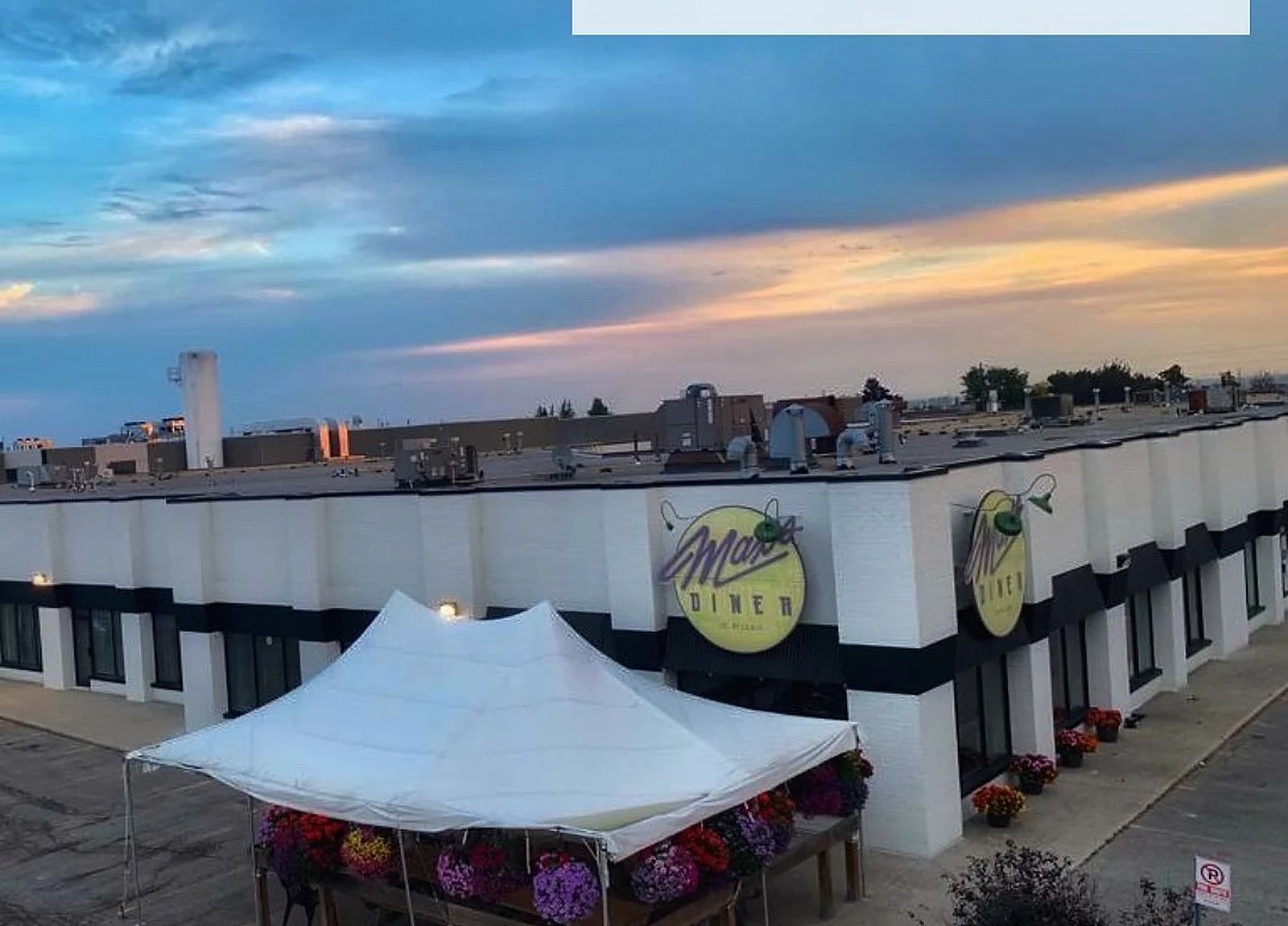 AFTER: same plaza painted white/black, sunset