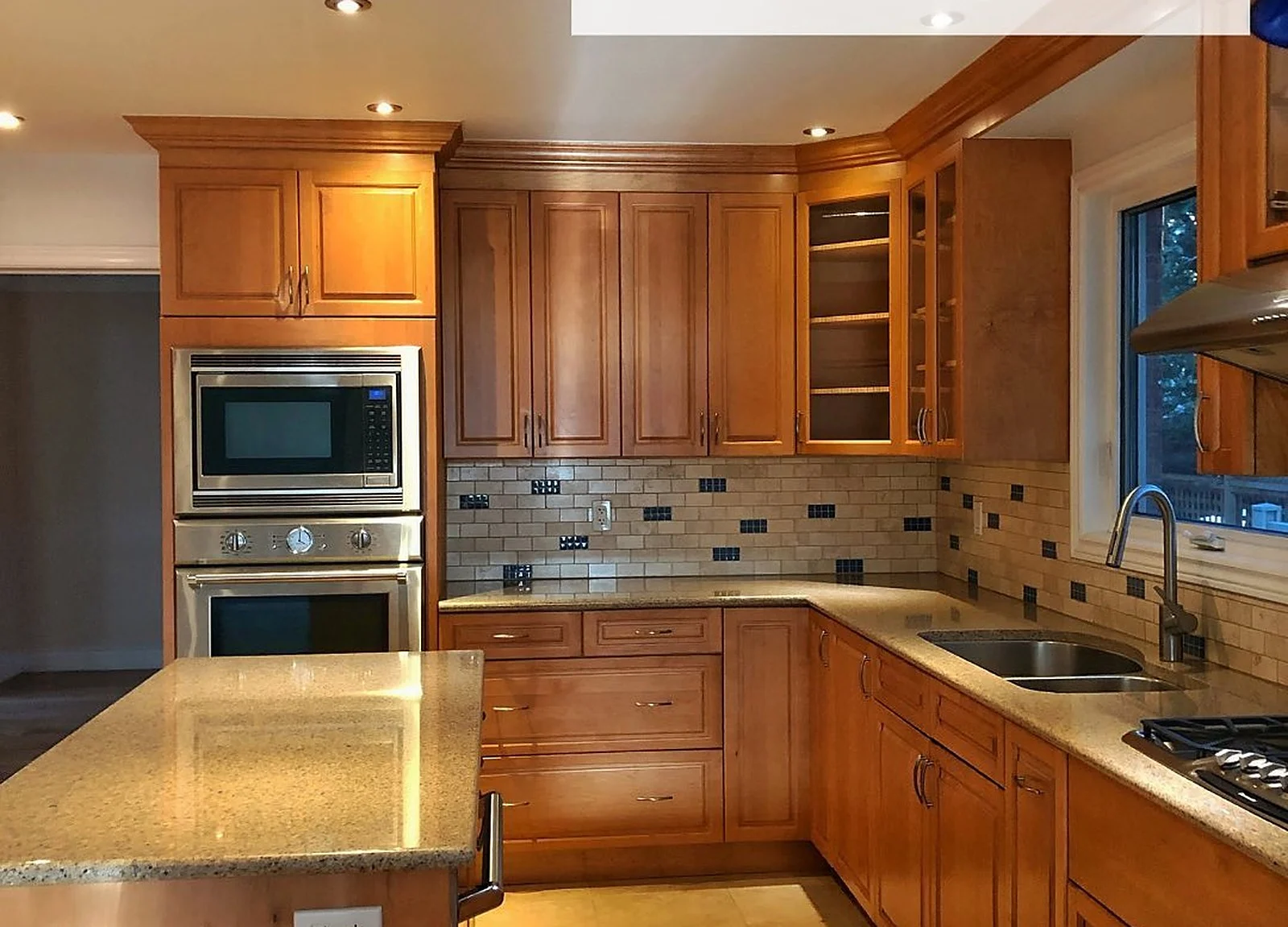 BEFORE: kitchen orange wood cabinets, angle 2