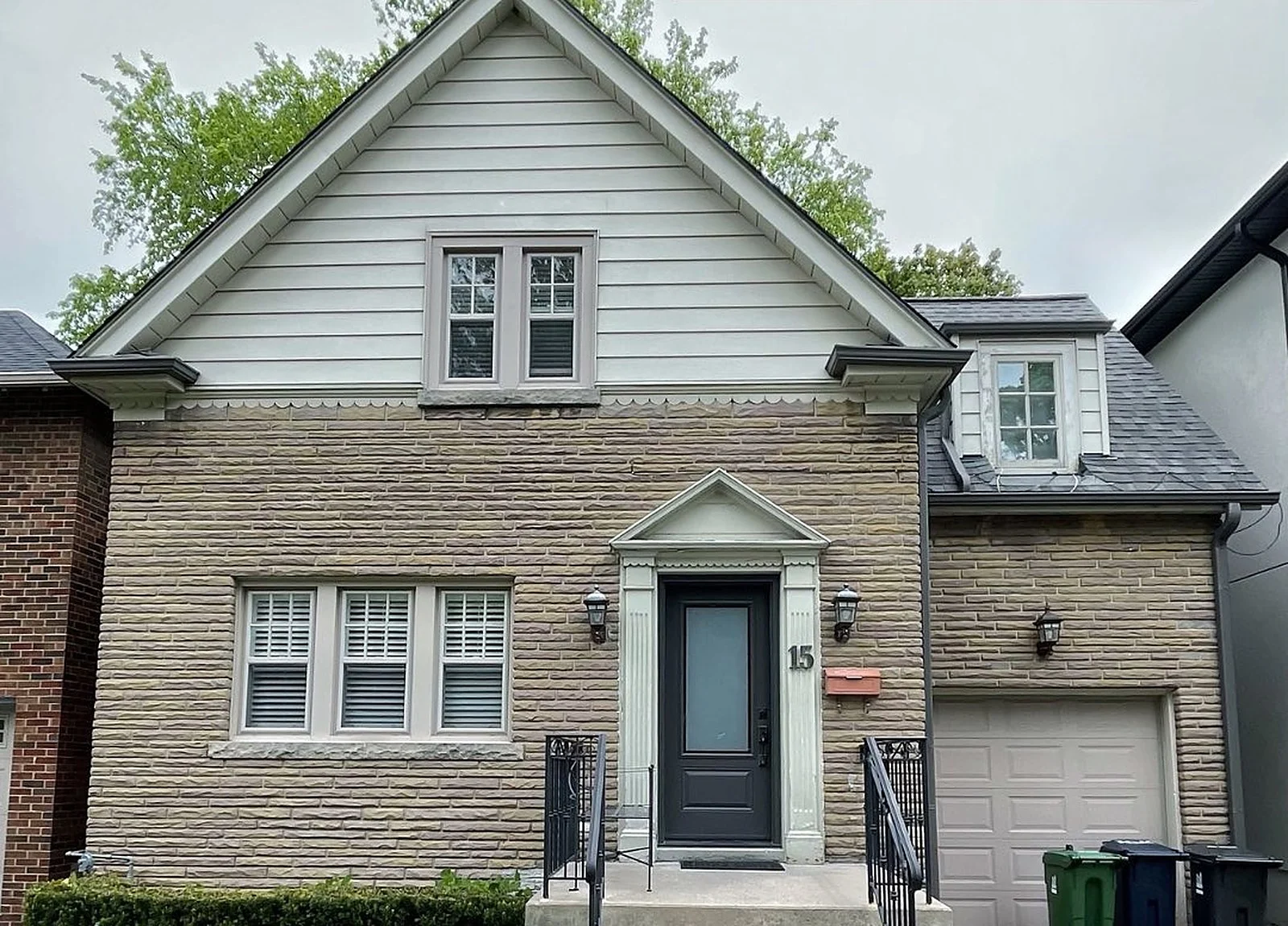 BEFORE: same house with pale grey siding
