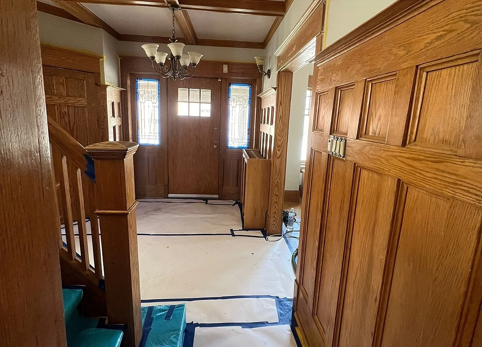 BEFORE: oak-panelled entry hall