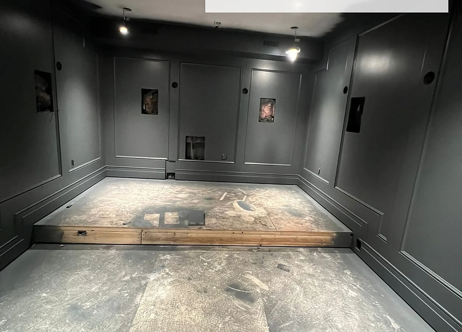 AFTER: dark theatre walls, empty floor