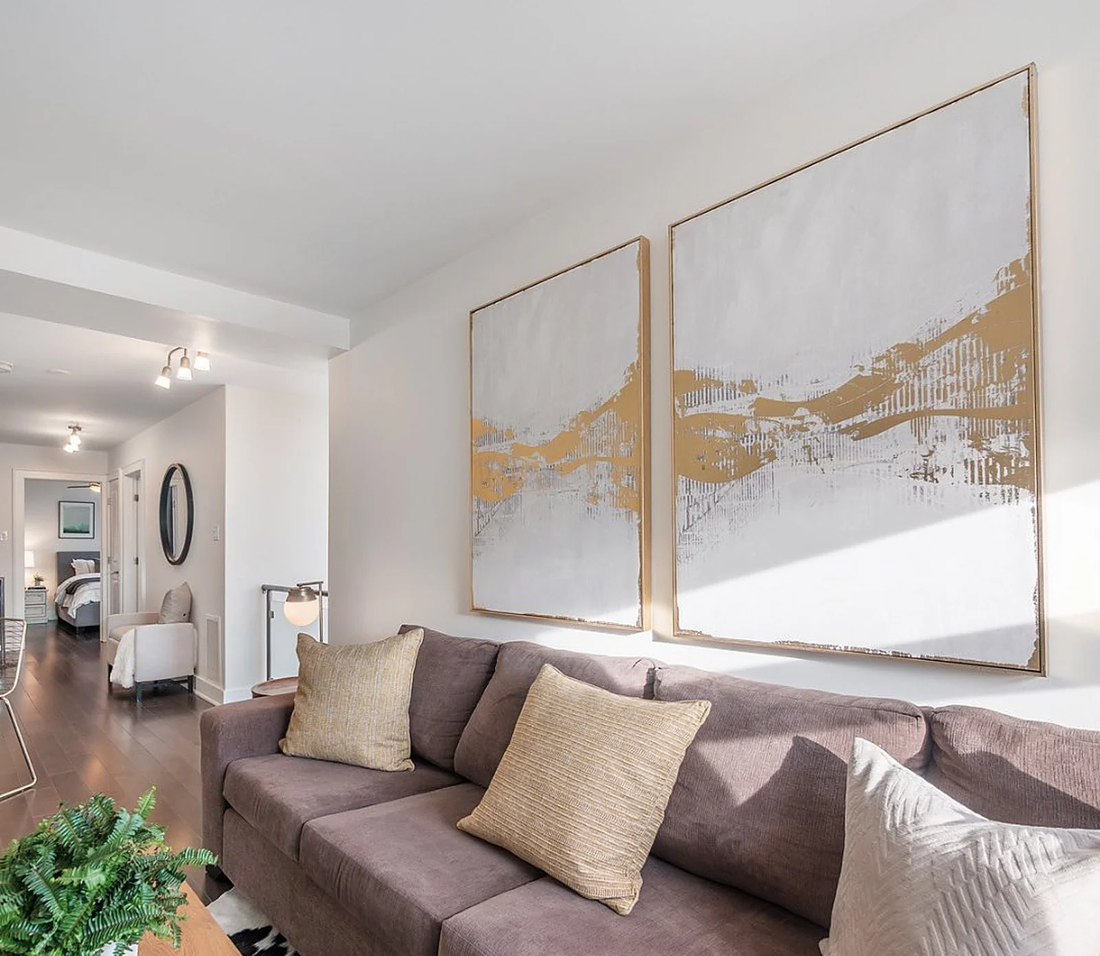 Penthouse living room, mauve sofa, white walls