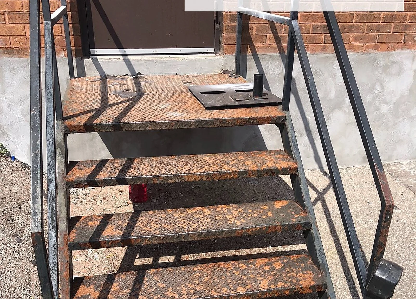 BEFORE: rusty metal exterior stairs
