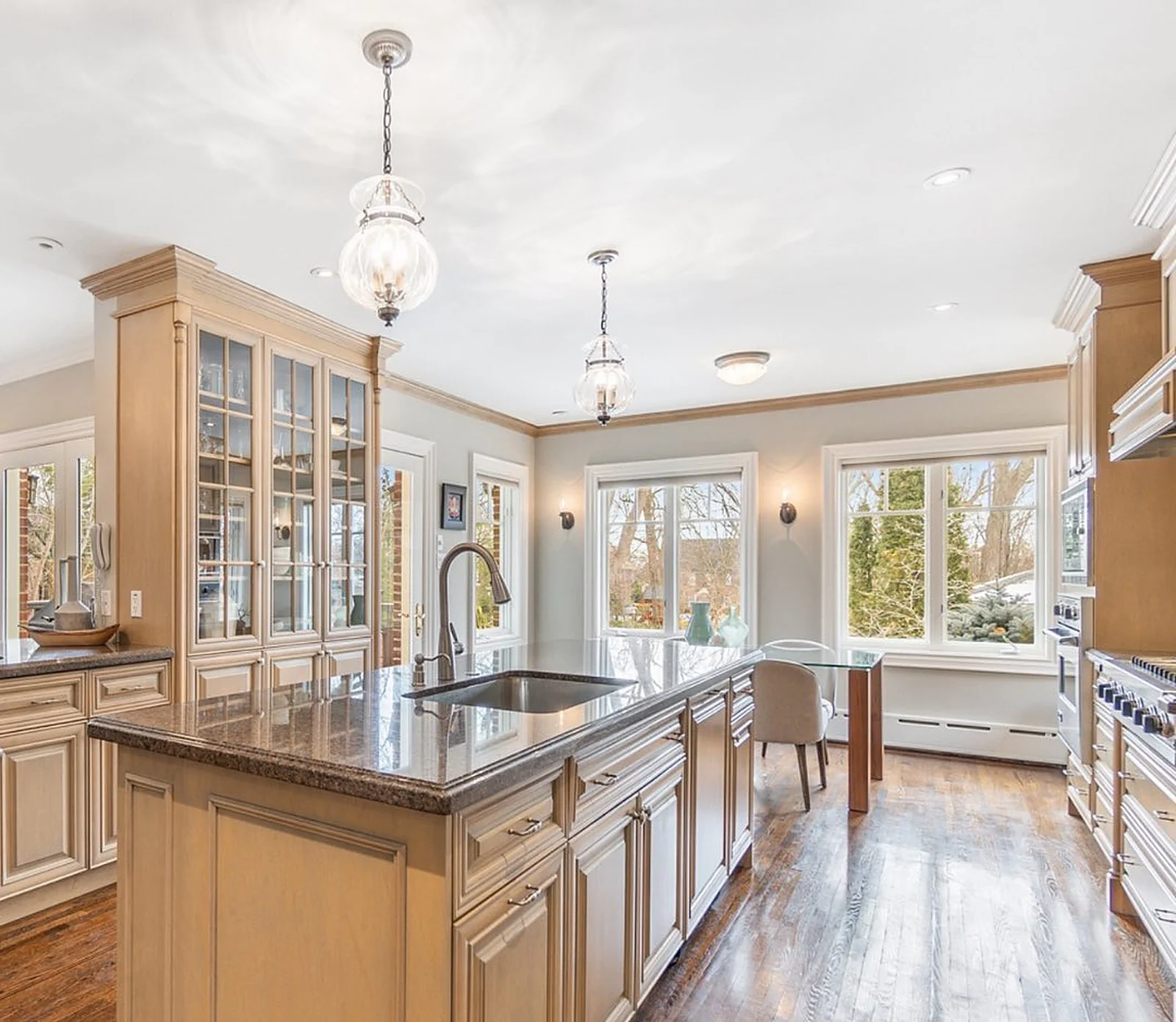 Kitchen with natural wood cabinets, light walls