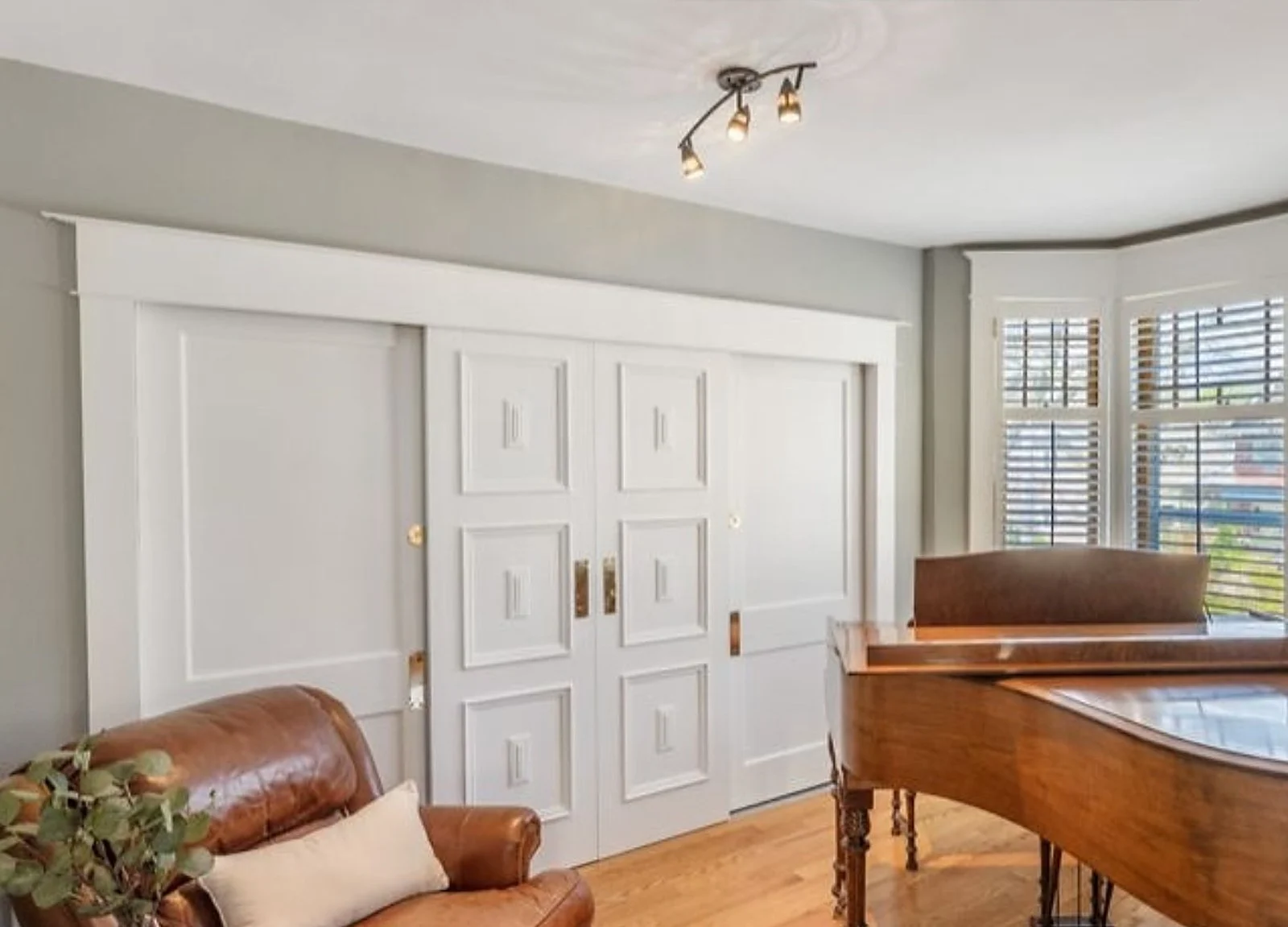 AFTER: pocket doors painted white, piano room