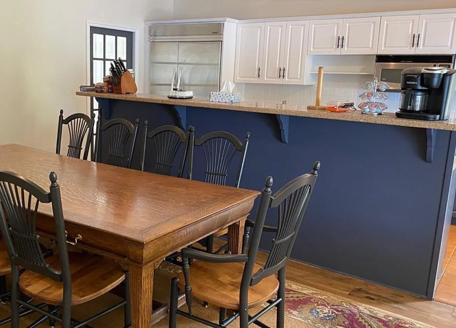 AFTER: cottage kitchen navy island and dining table