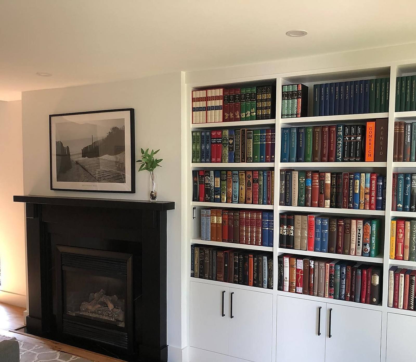 Fireplace wall and built-in bookshelves in an Oakville lakefront home