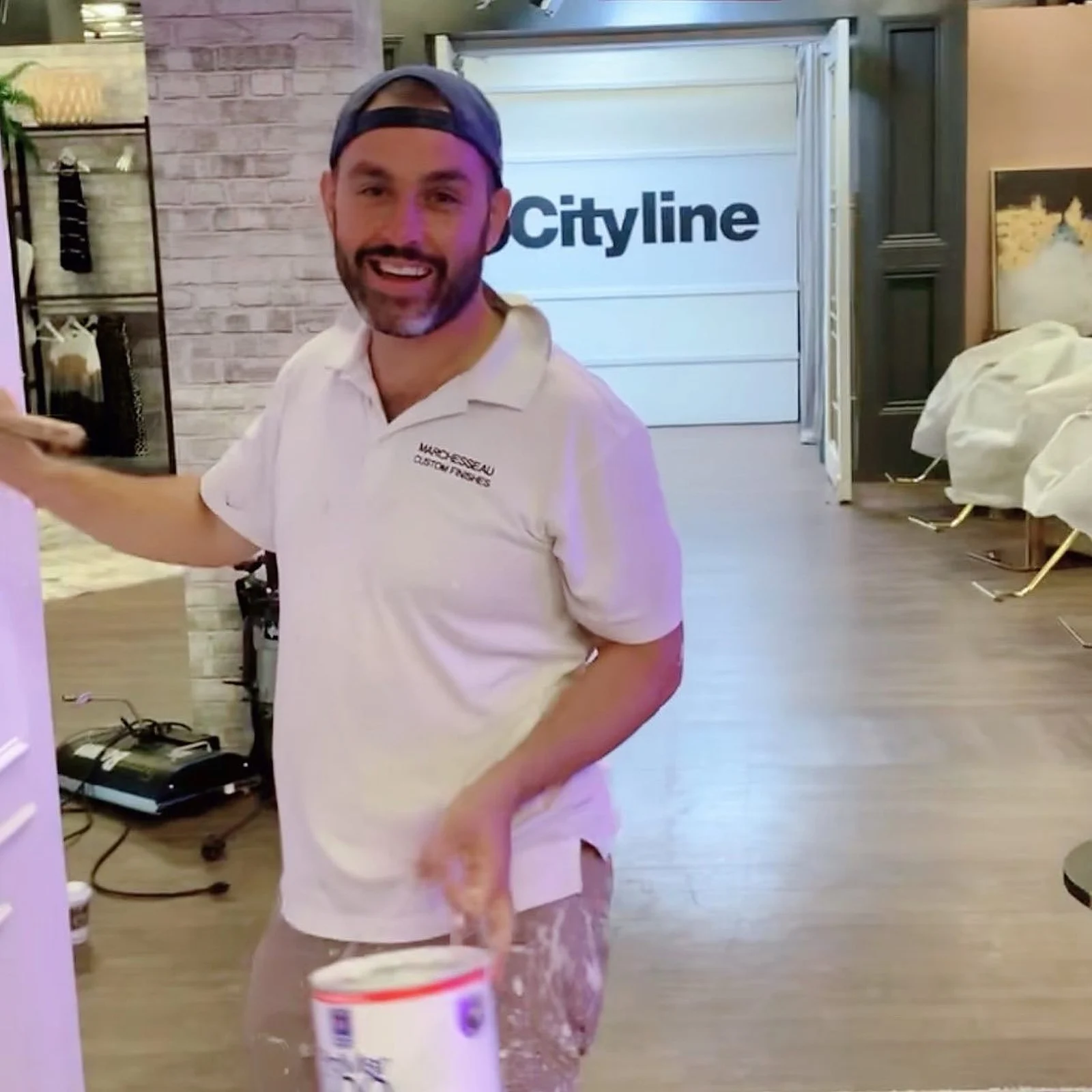 Paul Marchesseau smiling on the Cityline set with a paint can